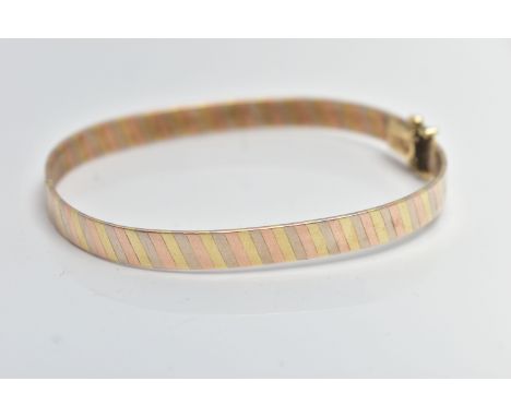 A 9CT GOLD TRI COLOUR HINGED BANGLE, bangle width 6.3mm, fitted with an integrated box clasp with two additional figure of ei