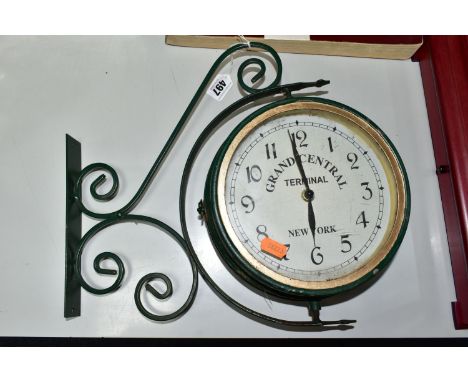 A GRAND CENTRAL, NEW YORK REPLICA WALL MOUNTABLE CLOCK, with temperature gauge verso, the case painted green and pivoting on 