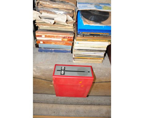 A FIDELITY RECORD PLAYER in red covering (not working) and two trays containing classical and operatic LPs and 78s