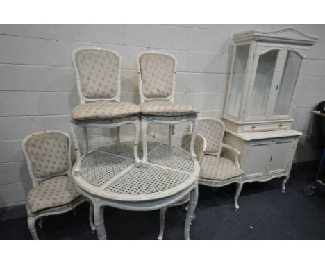 A CREAM FRENCH BAMBOO STYLE DINING SUITE, comprising a circular table, with glass inserts, diameter 110cm x height 76cm, five