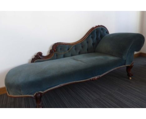 A Victorian mahogany and button upholstered chaise longue on turned feet with castors CONDITION REPORT: Upholstery dirty and 