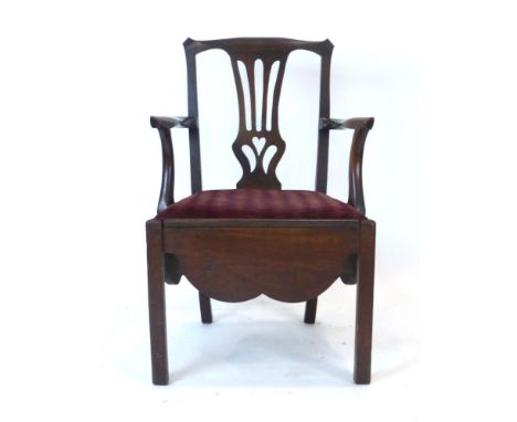 An 18th century oak framed commode chair