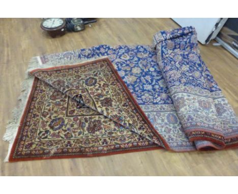 A Persian-type woolen carpet with a floral indigo ground, 410 x 390 CONDITION REPORT: Tassells worn one end.