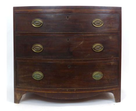 A 19th century mahogany and walnut crossbanded bow-fronted chest of three long graduated drawers on bracket feet, w. 91 cm CO