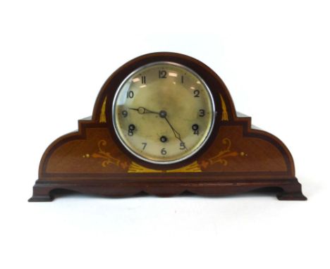 An early 20th century chiming mantel clock, the silvered dial with Roman numerals, within a mahogany and inlaid case of Napol