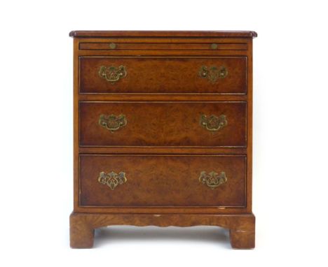 A reproduction George I-style elm and strung bachelors chest of three drawers on bracket feet, w. 61 cm