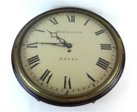 A 19th century station-type clock, c. 1820, the enamelled face with Roman numerals, inscribed 'Berncastle Lewes', within a ci