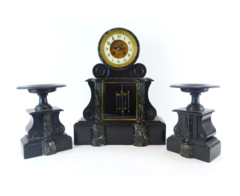 A late 19th century mantel clock and garnitures, the enamelled and brass face with visable escapement and Arabic numerals, in