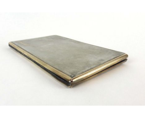 An early 20th century silver, parcel gilt and engine turned cigarette case of cushioned rectangular form, Asprey, London 1936