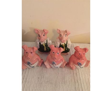 5 pig money boxes, one marked Wade