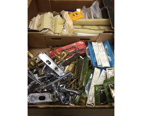 Two trays of handles and light switches