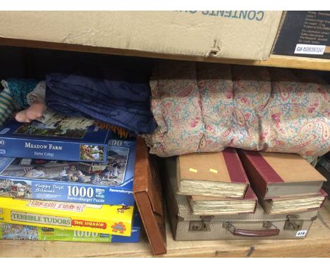 Shelf of assorted including books, paisley quilt etc.