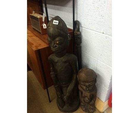 2 carved figures and a walking stick