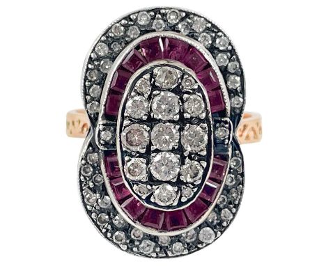 A rose gold Georgian style rose gold diamond and ruby dress ring. Set with 55 round cut diamonds and 16 square cut rubies, th