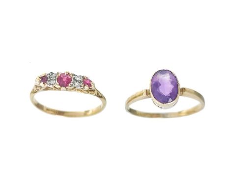 Two 18ct gem set rings. One is a diamond and ruby set seven stone ring, stamped 18ct, size M 1/2, the other ring with an oval