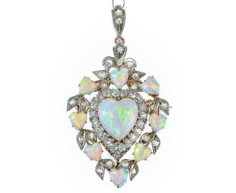 An exquisite Edwardian diamond and opal heart shaped brooch pendant by Depree & Young Ltd Exeter. Set in high purity rose gol
