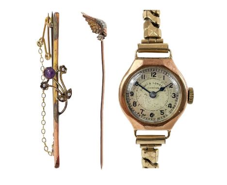 A rose gold tie pin set with a small old cut diamond. The head formed as a wing, length 5cm; together with a 9ct amethyst and
