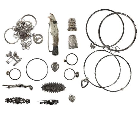 A collection of silver jewellery. To include three bangles, a Scottish golf and thistle brooch, two silver and yellow metal r