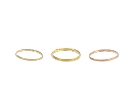 A modern 18ct hallmarked gold thin band ring. Size K, 1.3g; together with two gold thin band rings, 0.87g, total weight 2.17g