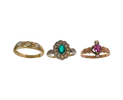 Three gold stone set rings. One is a 9ct opal ring, size N, a rose gold garnet and seed pearl ring, size N 1/2, and a 9ct and