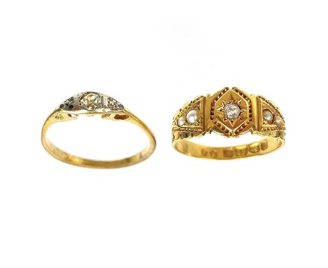 A Victorian 18ct diamond and seed pearl set ring and a diamond solitaire ring. The Victorian band ring with a central star se
