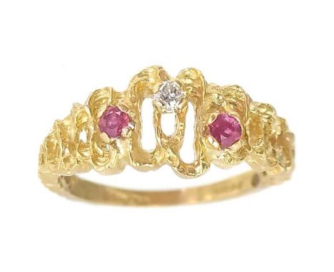 An 18ct gold diamond and ruby set three stone ring. The round cut diamond of 0.03ct approximately, the rubies of similar size