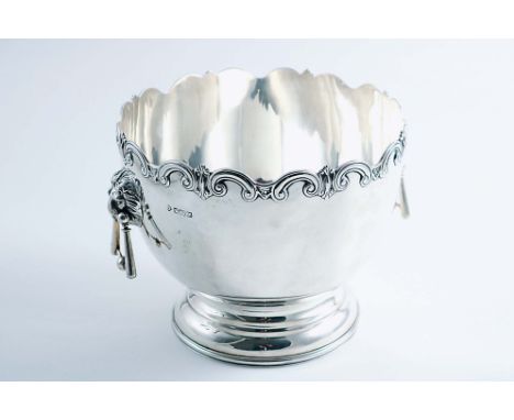 AN EDWARDIAN ROSE BOWL with a wavy scroll rim, a domed circular foot and twin, lion mask &amp; drop handles, by R. Martin &am