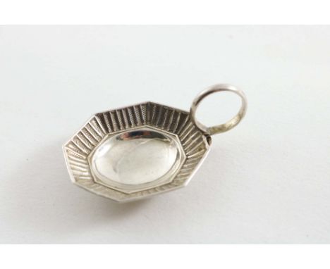 A GEORGE III CADDY SPOON with a ring handle and a small octagonal bowl with a stamped chevron border, by Samuel Pemberton, Bi