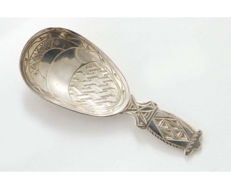 AN ARTS &amp; CRAFTS CADDY SPOON with engraved geometric patterns in the bowl and on the stem, by Liberty &amp; Co., Birmingh