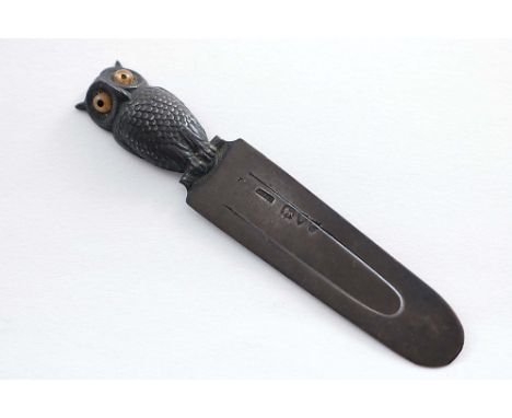 A LATE VICTORIAN NOVELTY BOOKMARK with an owl finial, coloured glass eyes, by Sampson Mordan &amp; Co., London 1895;  3.55"  