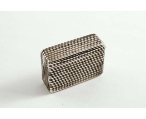A GEORGE IV REEDED RECTANGULAR SNUFF BOX unusual in that it hinges open along an edge so that it can be used "upright" rather