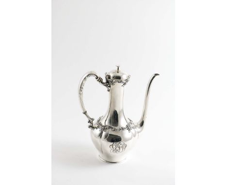 AN EARLY 20TH CENTURY AMERICAN COFFEE POT with a long slender neck and spout, floral scroll borders and a domed cover with a 