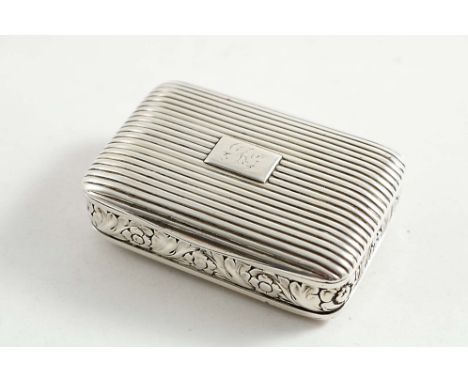 A GEORGE III / IV SCOTTISH SNUFF BOX of rounded oblong form with a reeded cover &amp; base &amp; a chased floral frieze aroun