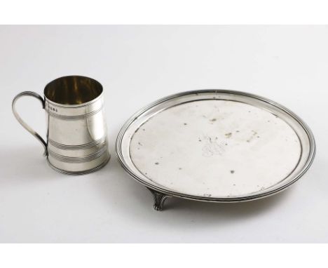 A GEORGE III SMALL CIRCULAR SALVER with a reeded border and fluted bracket feet, engraved in the centre with a crest &amp; in