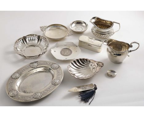 A MIXED LOT:- A small oval dish or stand with a decorative border, by Liberty &amp; Co., Birmingham 1913, two cream jugs, fiv