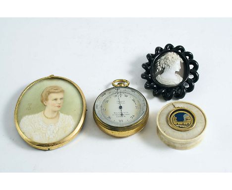 A POCKET BAROMETER with silvered dial in gilt brass case, Callaghan &amp; Co., 5 cms; a Victorian shell cameo brooch, a minia