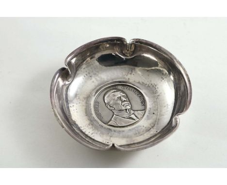 AN EARLY 20TH CENTURY PIN DISH of shaped circular outline with an inset portrait medallion of "NEVILLE CHAMBERLAIN", by R.E. 