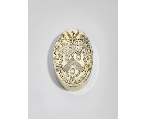 A GEORGE III SILVERGILT OVAL SNUFF BOX engraved on the cover with a coat of arms* and crest within foliate scroll mantling an