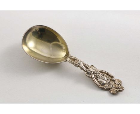 A VICTORIAN CADDY SPOON with a gilt bowl and a fruiting vine stem, by Hyam Hyams, London 1872;  4"  (10 cms) long;  0.6 oz