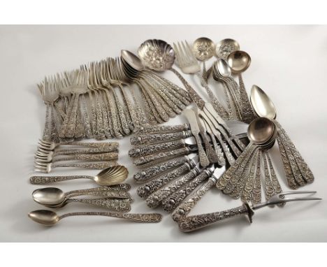 A 20TH CENTURY AMERICAN PART-CANTEEN OF FLATWARE &amp; CUTLERY decorated in relief with a repousse floral pattern to include: