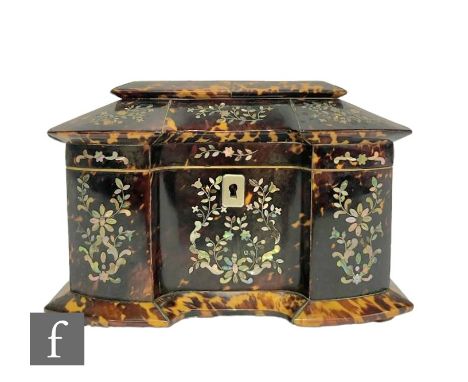 An early 19th Century Regency tortoiseshell tea caddy of inverted breakfront form, inlaid with white metal wirework, mother o