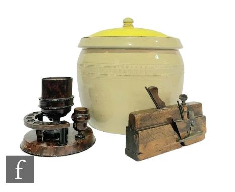 A wooden pipe stand and a router plane, stamped A Bradfield, a Doulton &amp; Co Improved Doulton bread pan and a stained glas