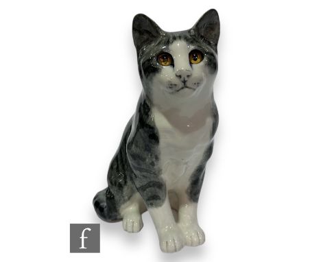 A large Winstanley cat by Mike Hinton, a seated silver tabby with white face and bib, hand painted marks to the base, height 