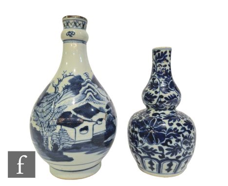 Two Chinese blue and white vases, to include an 18th Century example of bottle form, height 23cm, together with a 'Lotus' dou