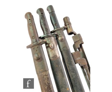 A 1907 Wilkinsons pattern bayonet and leather scabbard, another similar 1907 bayonet, another similar marked WSC 14 and three
