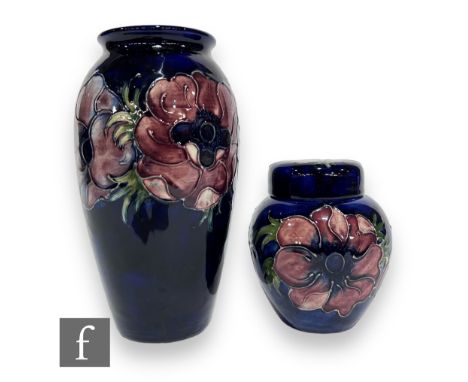 A post war Moorcroft Pottery vase of shouldered ovoid form with everted rim in the Anemone pattern, tubeline decorated with f