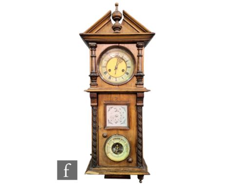 A late Victorian walnut cased wall clock/barometer, circular dial with eight day movement above a thermometer and aneroid bar