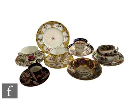 A collection of 19th Century and later Staffordshire china tea and coffee cups and saucers, all hand enamel decorated with fl