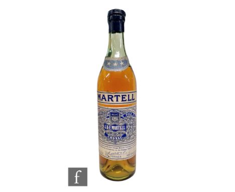 A bottle of Martell VOP 3 stars cognac brandy, with spring cap closed bottling, 1950s/60s bottling. 