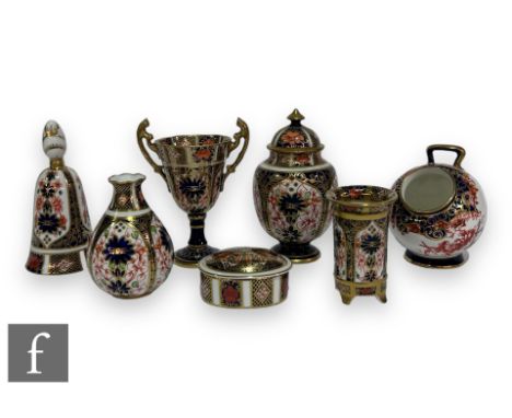 A small collection of 20th Century Royal Crown Derby porcelain items to comprise a table bell, oval pill box, small bud vase,